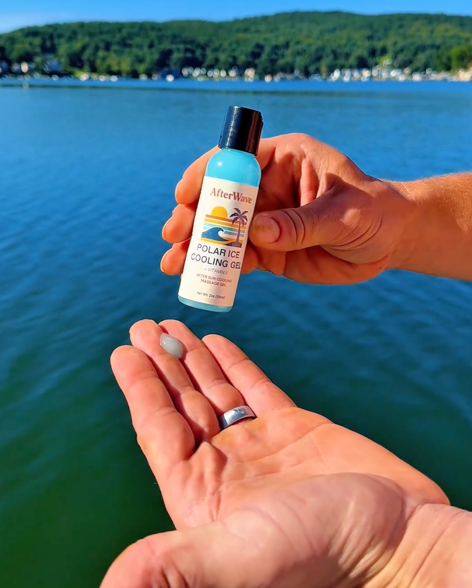 Person holding a bottle of AfterWave Polar Ice Cooling Gel for muscle soreness with a lake and trees in the background